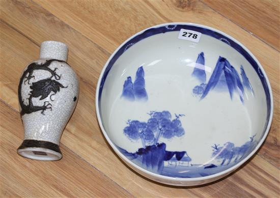 A Chinese crackle glaze vase, decorated in relief with a dragon, c.1910, height 17cm, a Japanese blue and white bowl and a pair of Japa